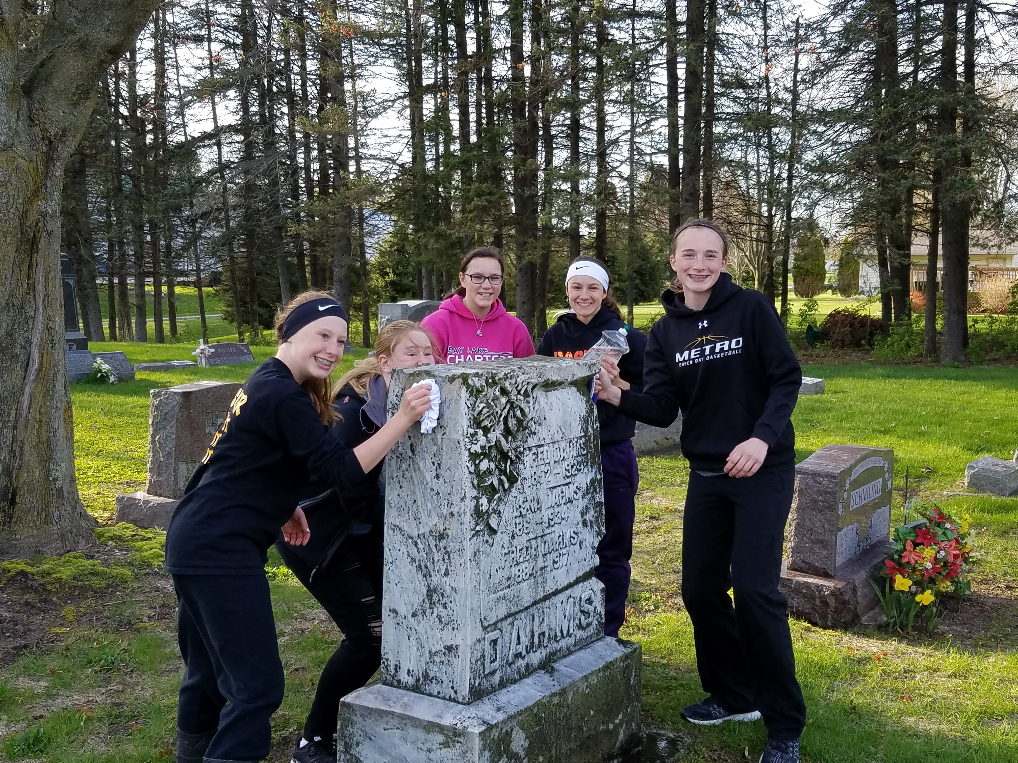 Catechism Class Cleans Gravestones